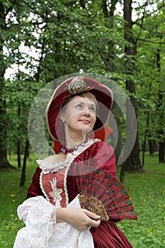 Woman poses in red dress photo