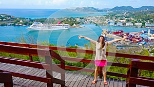 The woman posing against port or cruise dock at Saint Lucia island