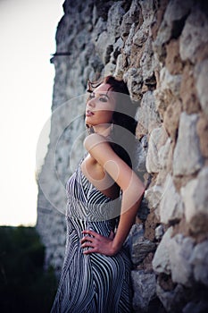 Woman Posing Against Stone Wall