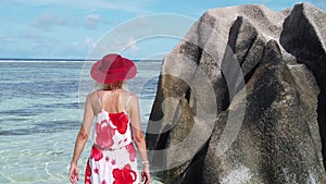 Woman posing at Anse Source d`Argent