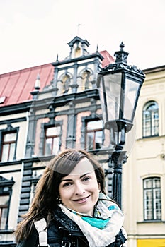 Woman posing with building and lantern in Main square, Kosice, b