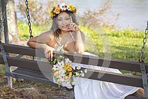 Woman Posing Casually On A Swing