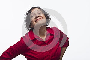 Woman posing comically against white background, horizontal