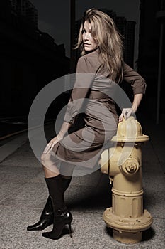 Woman posing by a frie hydrant