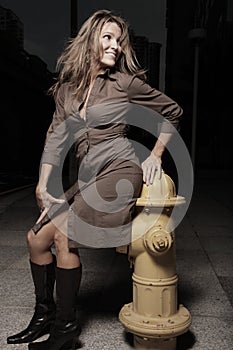 Woman posing by a frie hydrant