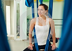 Woman posing on hammock antigravity yoga