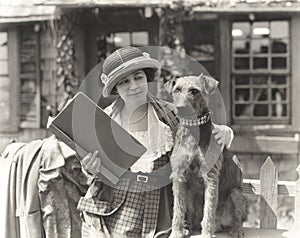 Woman posing with her wire hair terrier