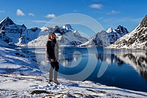 Woman posing in the mountains of the Lofoten Islands. Reine, Norway