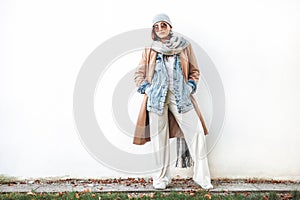 Woman posing in multilayered autumn outfit