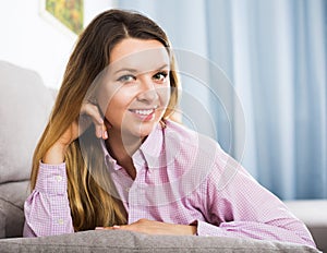 Woman posing playfully indoors