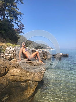 Woman posing on the rocks