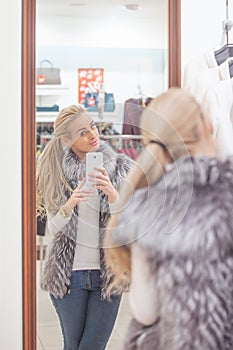 Woman posing for a selfie with a smart phone,