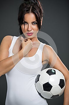 Woman posing with soccer ball