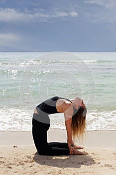 Woman posing ustrasana yoga