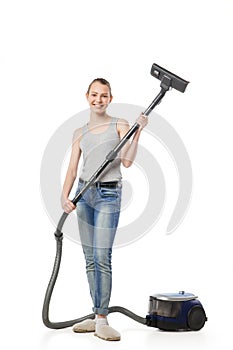 woman posing with vacuum cleaner over white