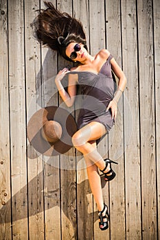 woman posing on wooden deck