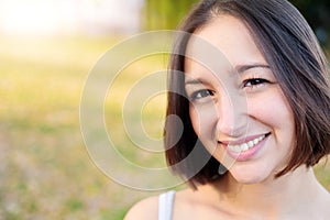 Woman with positive emotion face portrait smiling looking at the