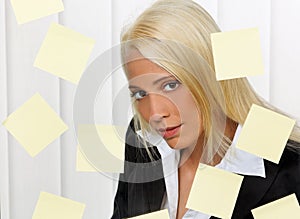 Woman with post-its many tasks photo