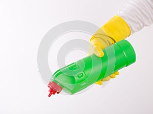 Woman pouring detergent from bottle on white background