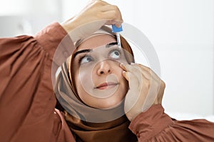 Woman Pouring Eye Drop Medication For Glaucoma