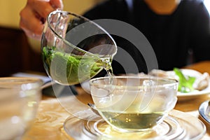 Woman pouring mint tea