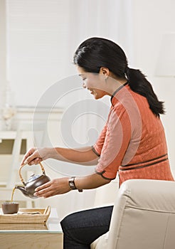 Woman Pouring Tea