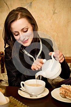 Woman pouring a tea