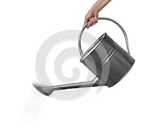 Woman pouring water from can on white background, closeup