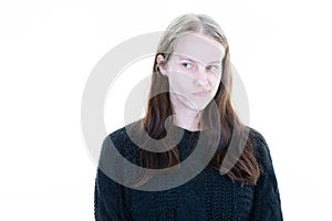 Woman pouts grimacing with her mouth on white background