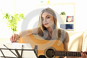 Woman Practice Acoustic Guitar Playing at Home