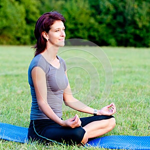 Woman practice yoga outdoor in park