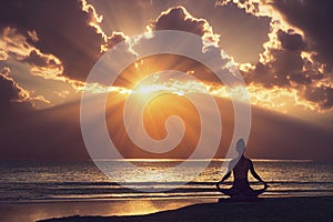 Woman practices yoga and meditation on the beach at sunset, generative AI