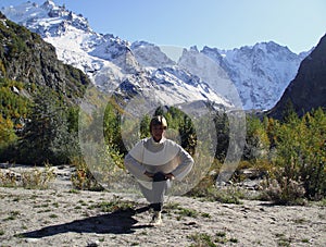 Woman practices yoga in a mountain gorge. Travel Lifestyle Relaxation. Emotional concept. Outdoor adventure. Harmony