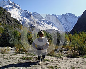 Woman practices yoga in a mountain gorge. Travel Lifestyle Relaxation. Emotional concept. Outdoor adventure. Harmony with na