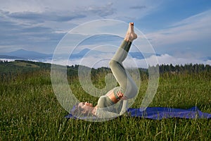 Woman practicing in balance exercises on fresh air