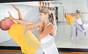 Woman practicing basic palm strike in self defense training