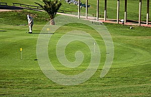 Woman practicing golf