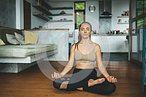 Woman practicing home yoga. Meditation