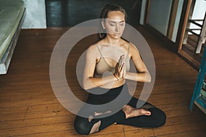 Woman practicing home yoga. Meditation