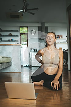 Woman practicing home yoga. Meditation