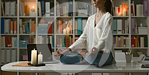 Woman practicing meditation at home