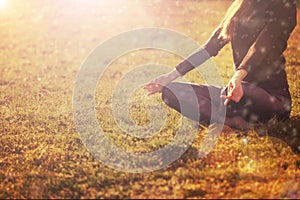 Woman practicing morning meditation in nature