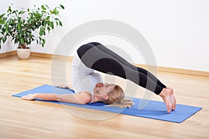 Woman practicing pilates