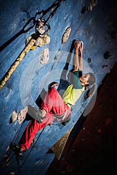 Woman practicing rock-climbing