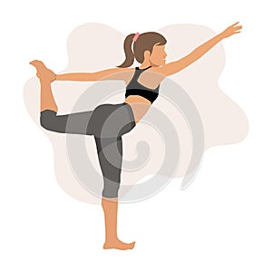 Woman practicing stretching exercise doing yoga asana Natarajasana - Lord of the dance pose