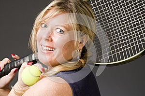 Woman practicing tennis stroke