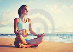 Woman Practicing Yoga on the Beach at Sunset