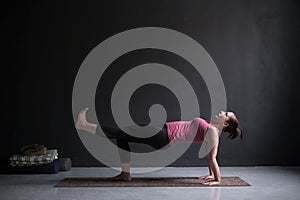 Woman practicing yoga concept, doing Purvottanasana exercise, Upward Plank pose