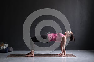 Woman practicing yoga concept, doing Purvottanasana exercise, Upward Plank pose
