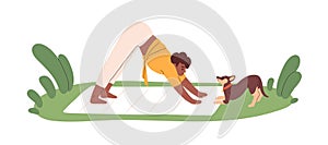 Woman practicing yoga exercises, Downward Dog Pose, with pet. Happy person during stretching workout with puppy